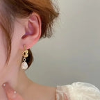 Pearl drop earrings on a gold-tone setting, view 5, King Watch