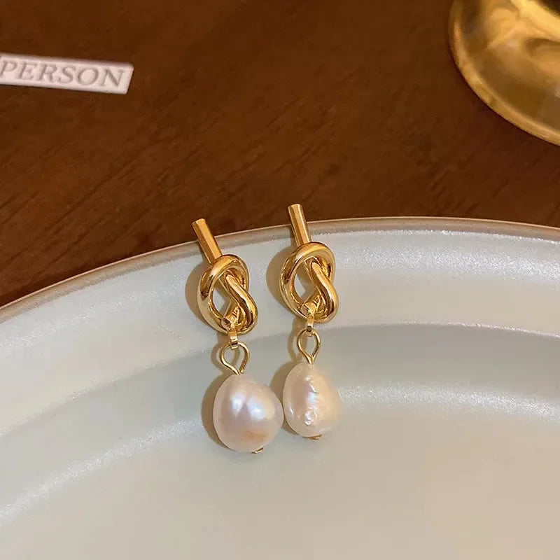 Pearl drop earrings on a gold-tone setting, view 4, King Watch